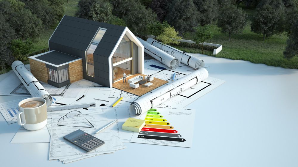 maison avec des plans, des diagrammes énergétiques et d'autres documents dans un champ